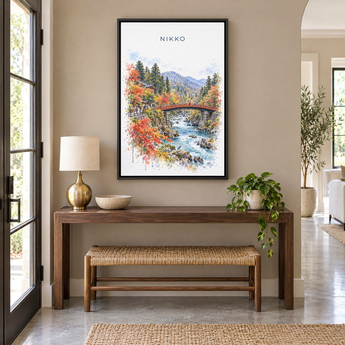 Nikko watercolor print as a black floater canvas above a walnut console and woven bench in an entryway
