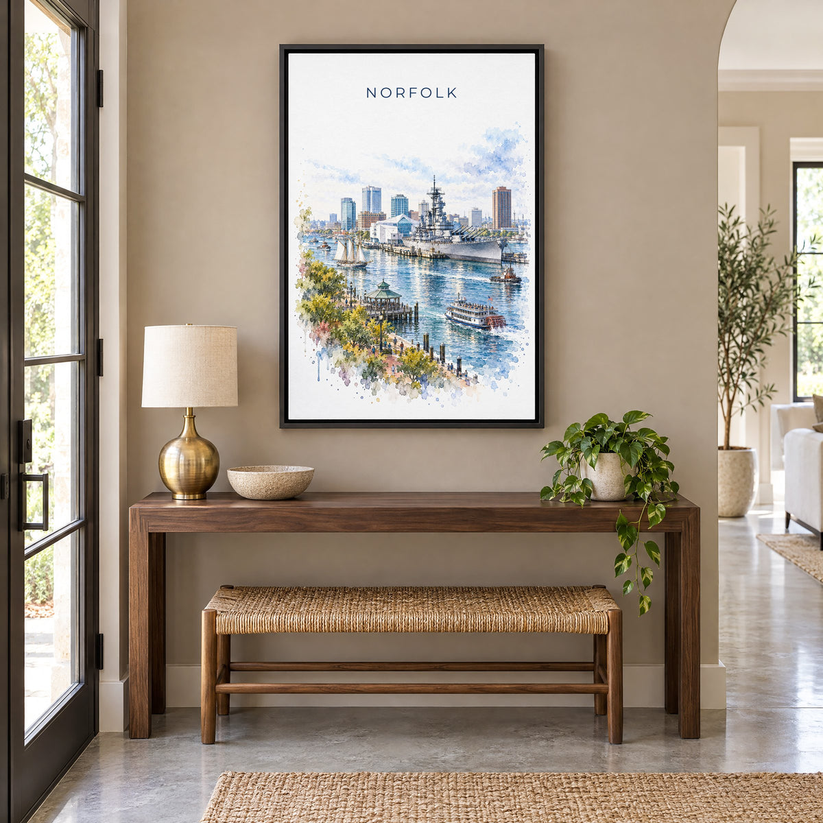 Norfolk, Virginia watercolor print as a black floater canvas above a walnut console and woven bench in an entryway