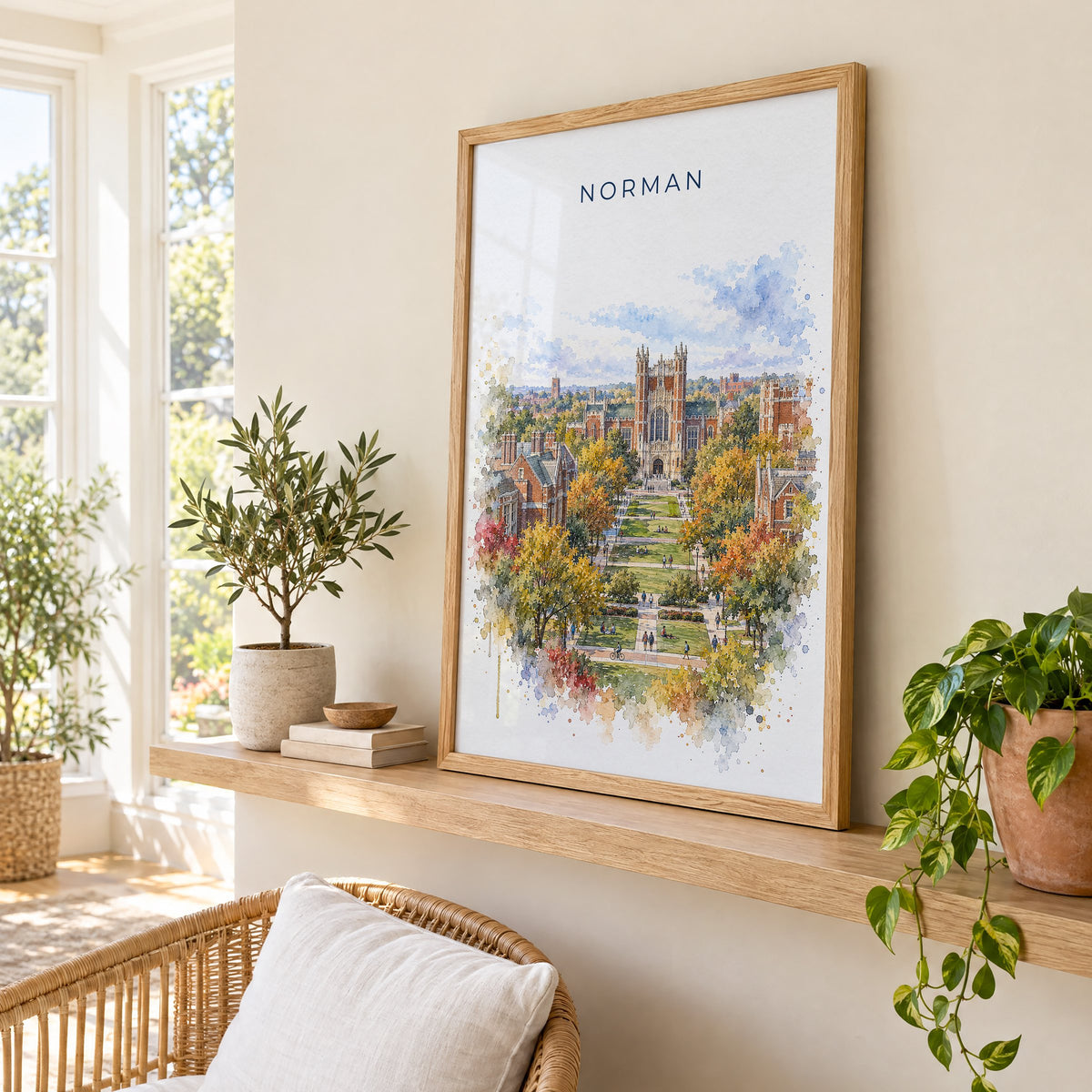 Norman, Oklahoma watercolor print in an oak frame on a picture ledge in a sunlit sunroom