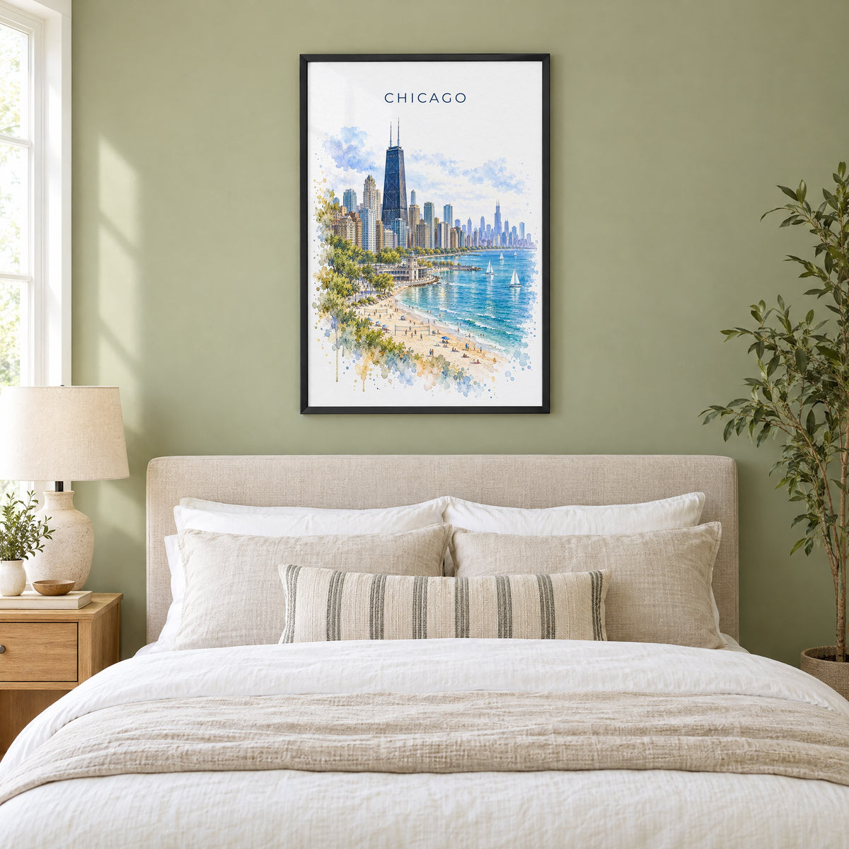 North Avenue Beach Chicago watercolor print in a black frame above an upholstered headboard in a sage green bedroom