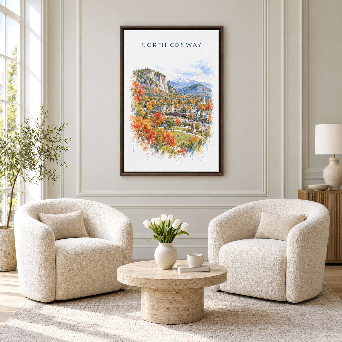 North Conway, New Hampshire watercolor print as an espresso floater canvas above two boucle armchairs in a hotel lounge