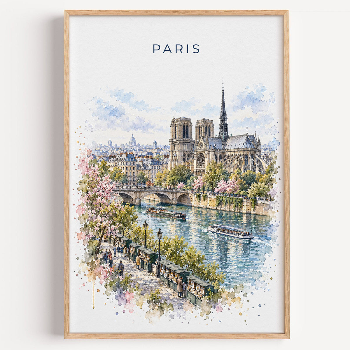 Notre-Dame Paris watercolor print in a light oak frame on a plain white wall