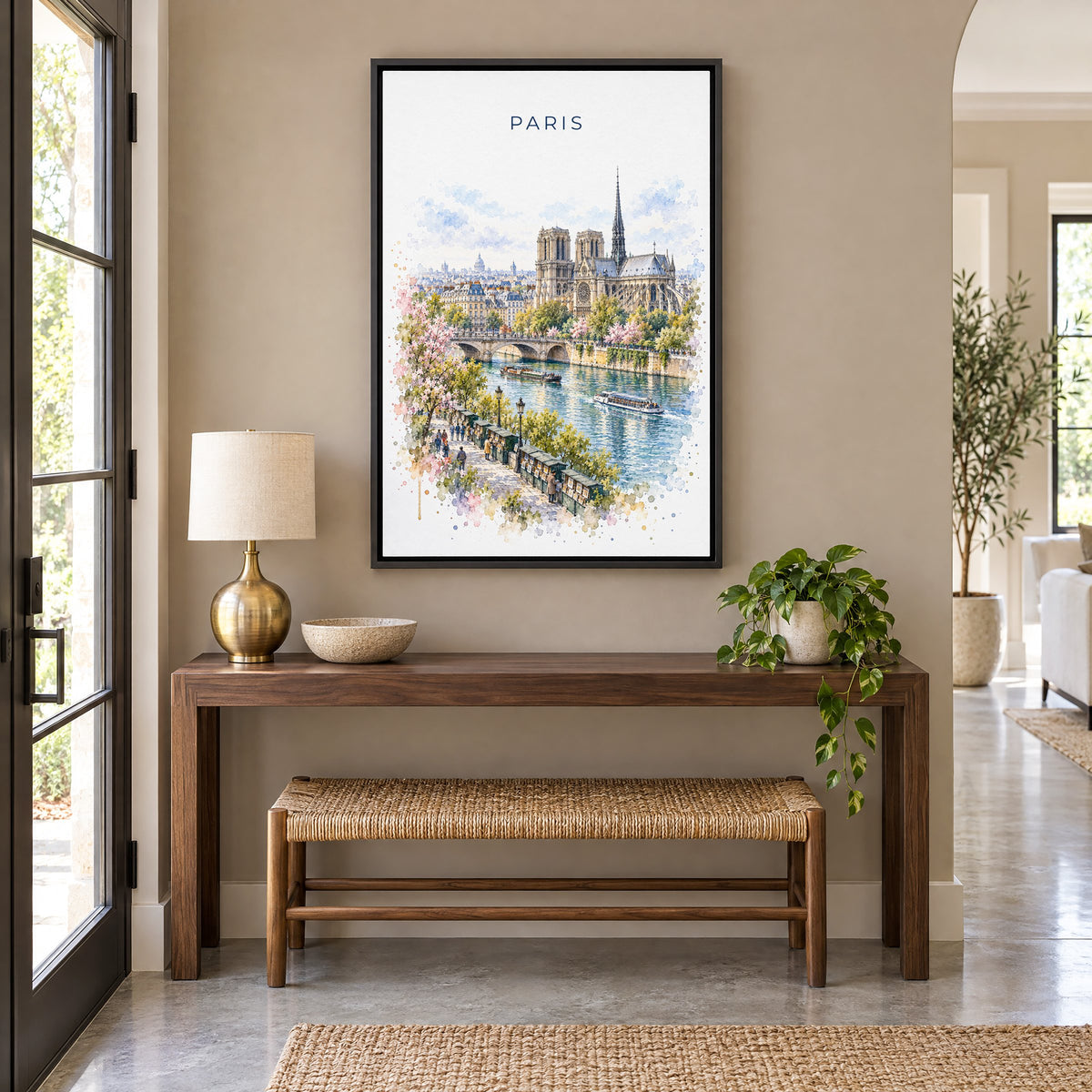 Notre-Dame Paris watercolor print as a black floater canvas above a walnut console and woven bench in an entryway