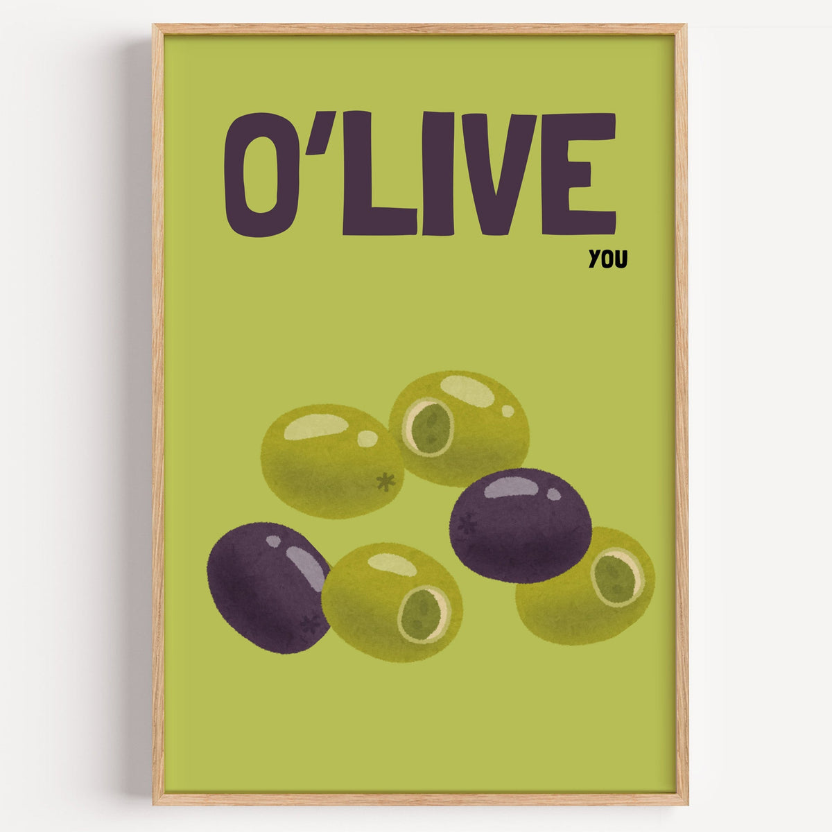 O Live You olives print in a light oak frame on a plain white wall