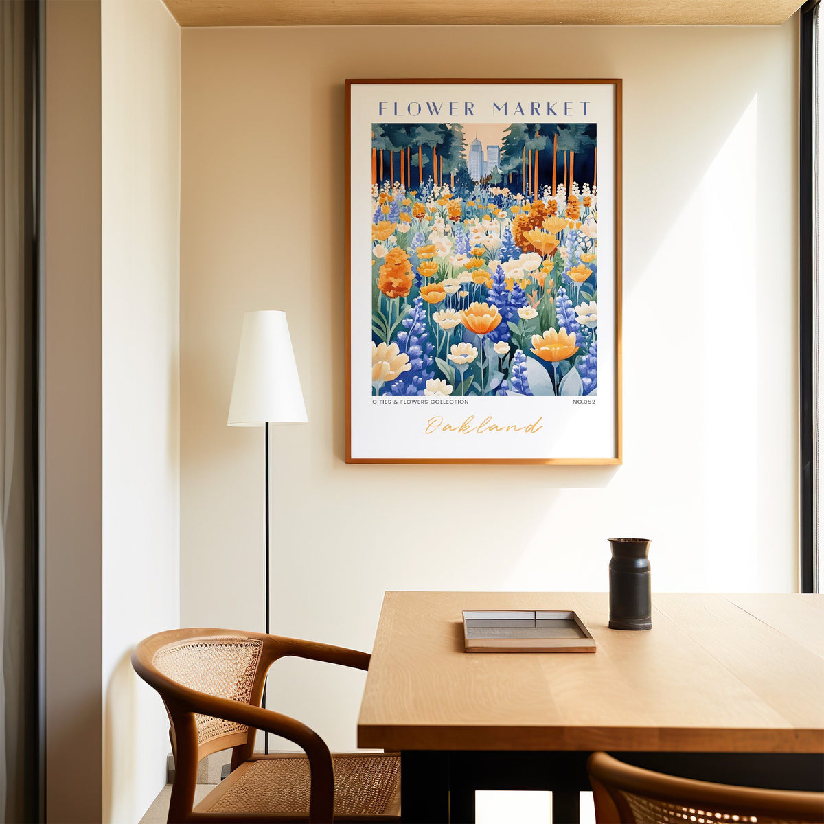 Oakland flower market print in an oak frame above a dining table and cane chair