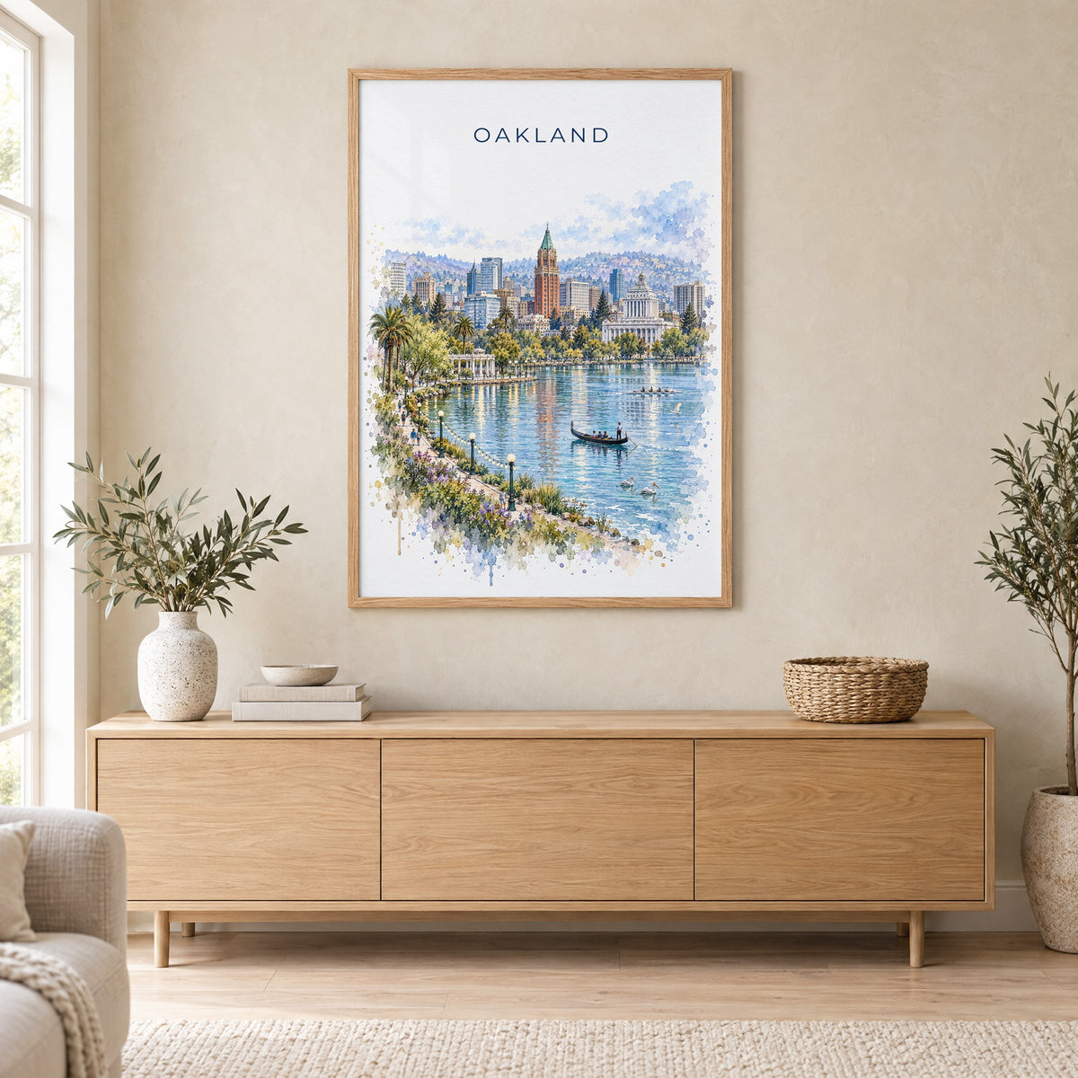 Oakland watercolor print in an oak frame above a light wood sideboard in a Scandinavian living room