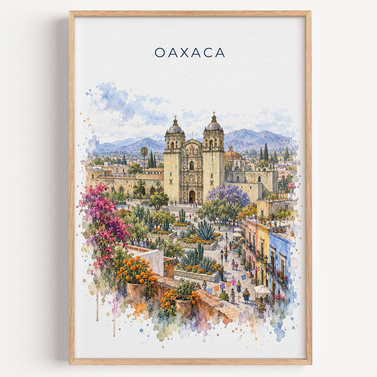Oaxaca watercolor print in a light oak frame on a plain white wall