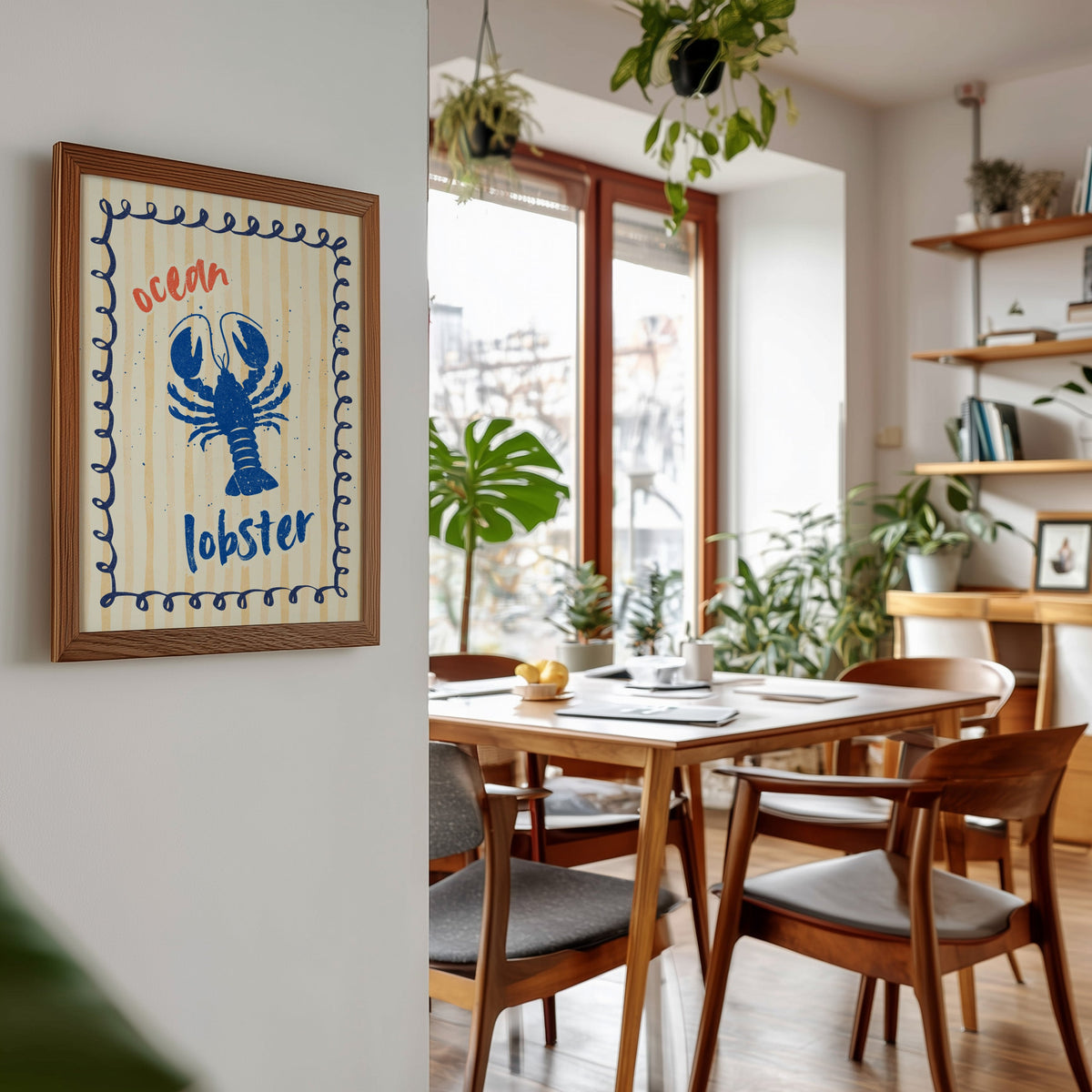 Blue lobster print in a walnut frame beside a mid-century dining table