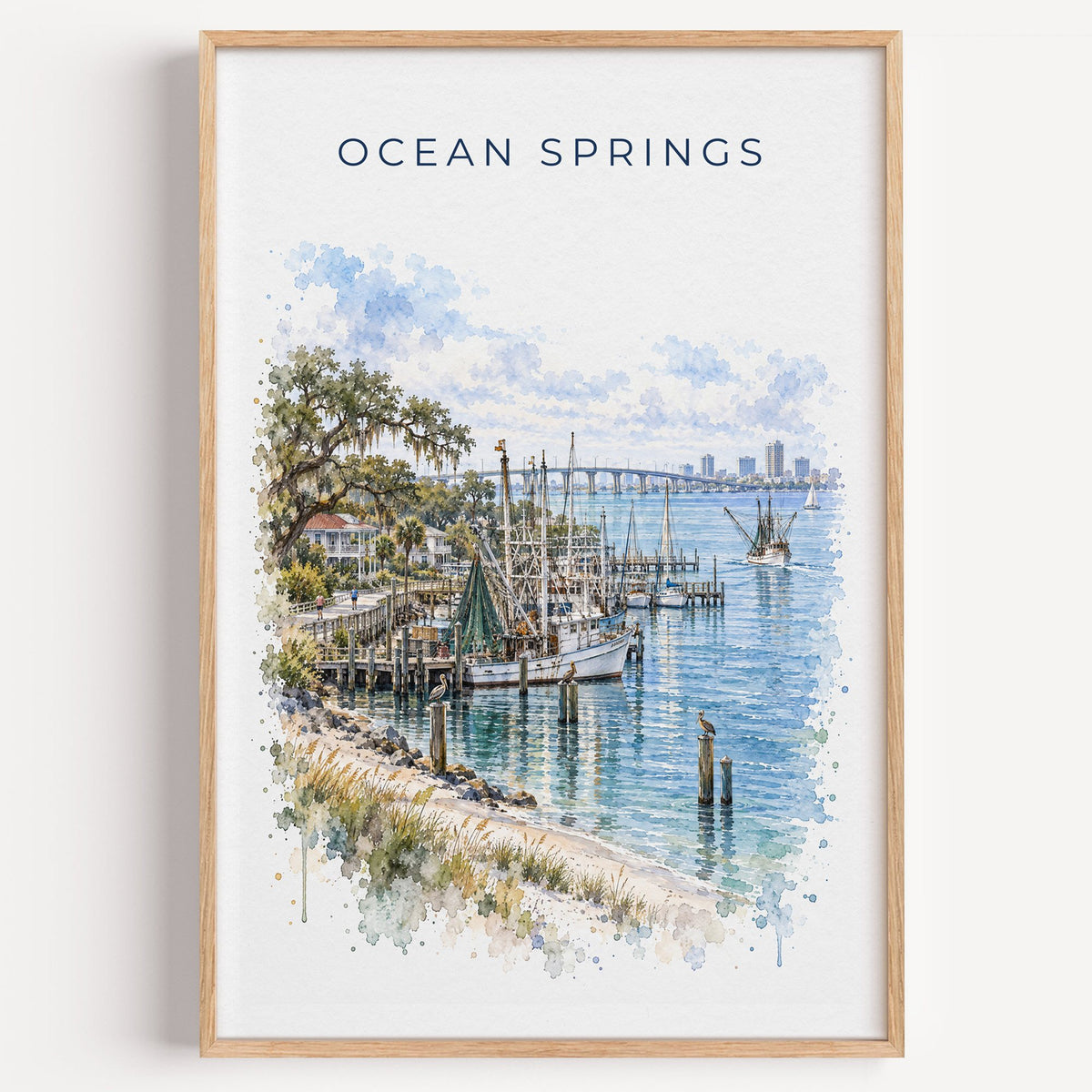 Ocean Springs, Mississippi watercolor print in a light oak frame on a plain white wall