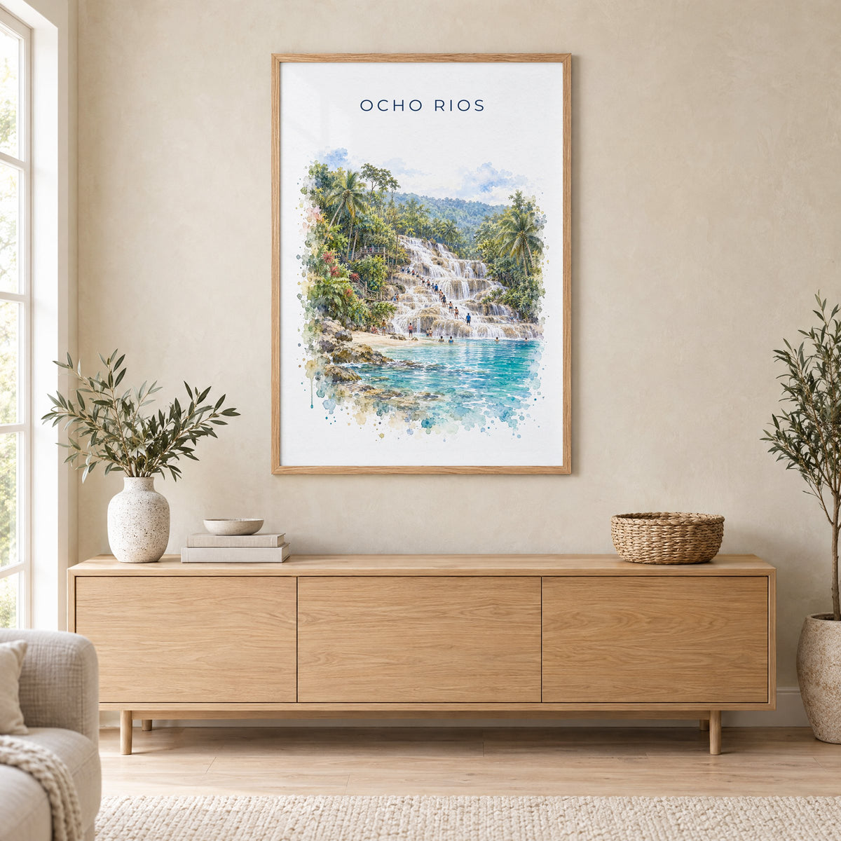 Ocho Rios watercolor print in an oak frame above a light wood sideboard in a Scandinavian living room