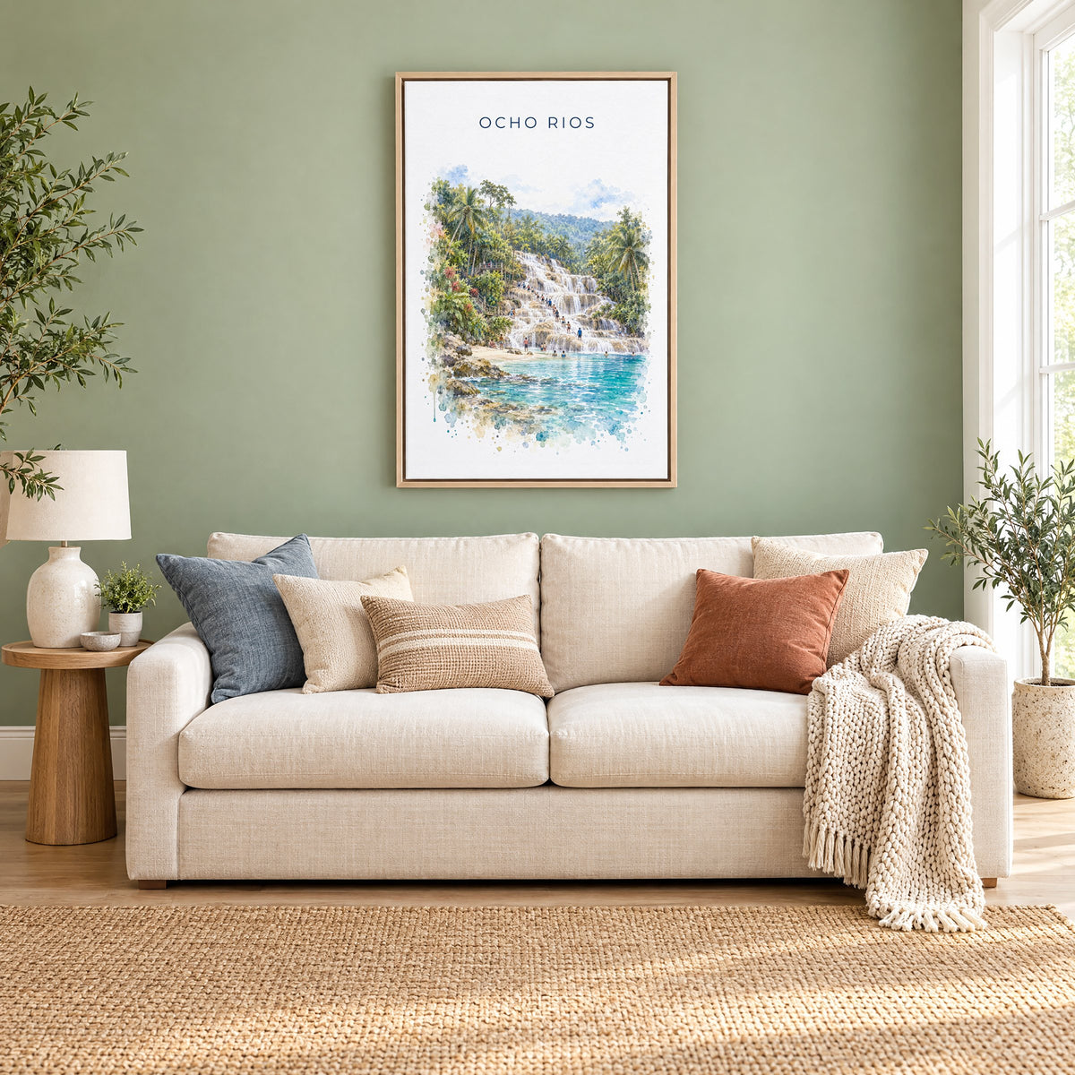 Ocho Rios watercolor print as a natural floater canvas above a cream linen sofa on a sage green wall