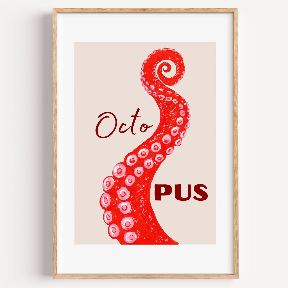 Octo PUS red gouache octopus tentacle print in a light oak frame on a plain white wall