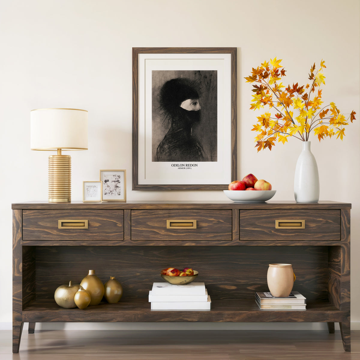 Armor 1891 print in a walnut frame above a console with autumn branches
