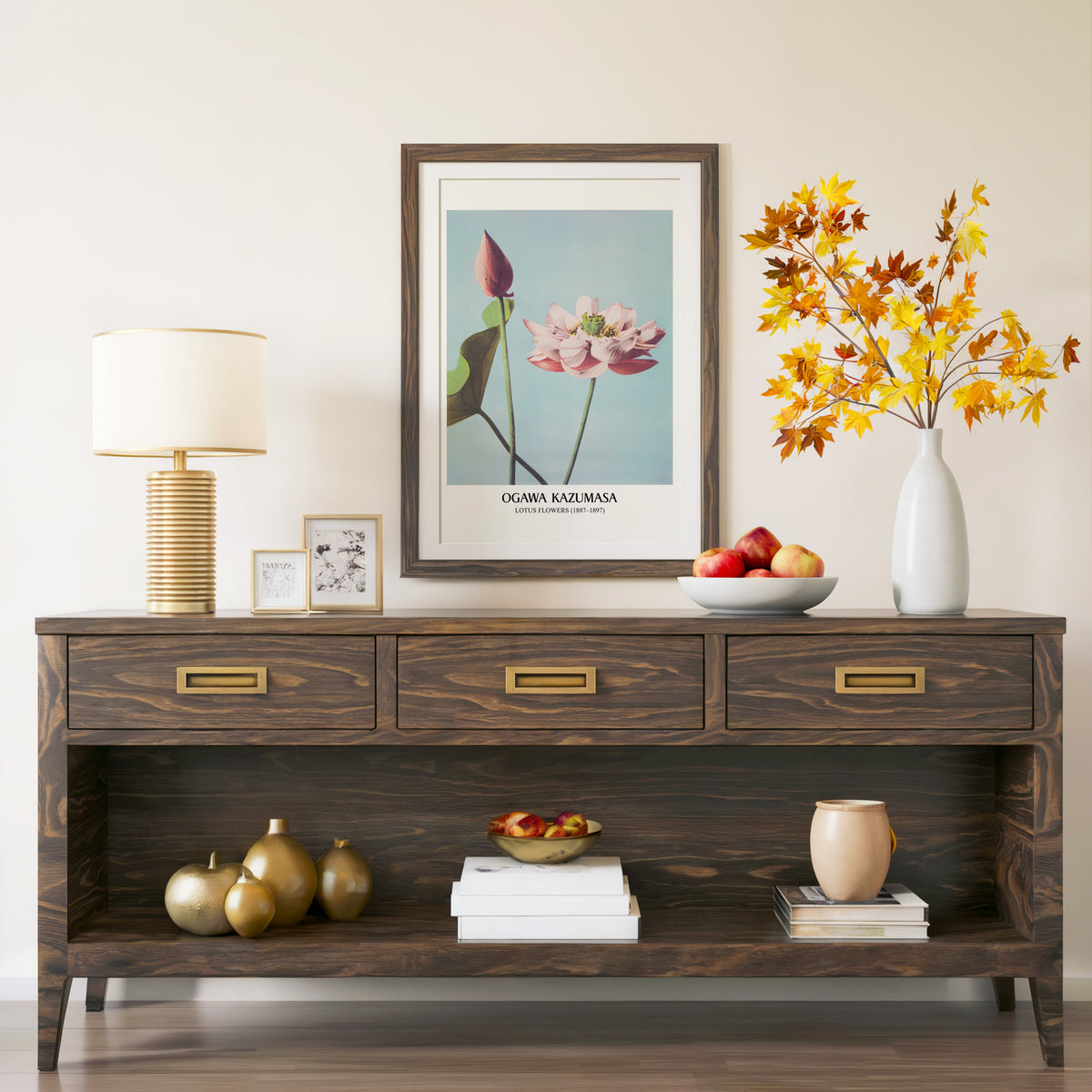 Lotus Flowers print in a walnut frame above a console with autumn branches
