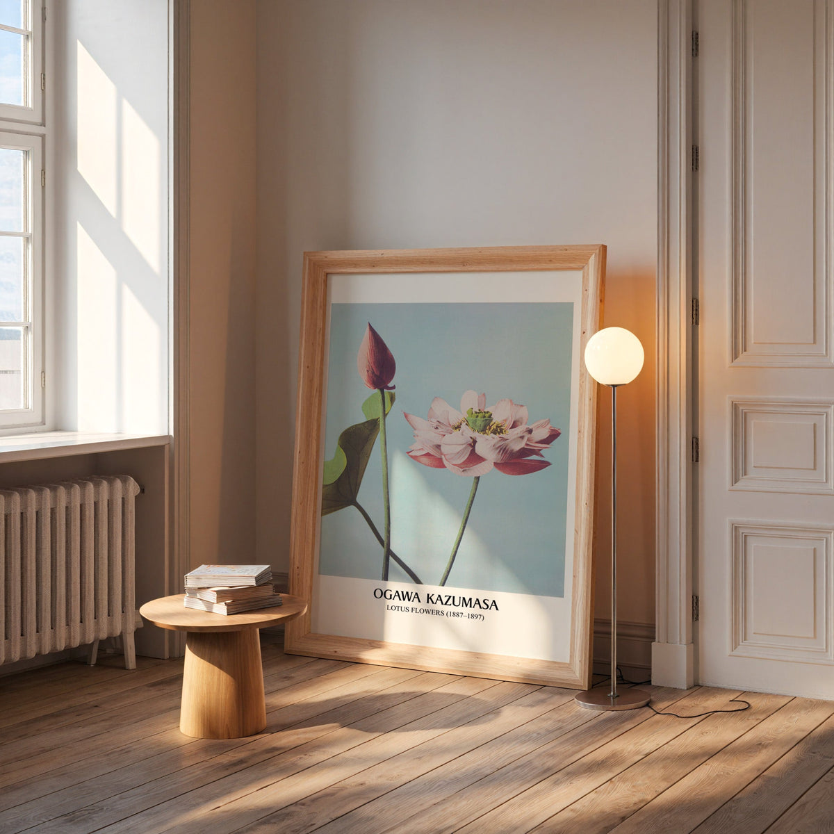 Ogawa lotus print in a wide pine frame leaning by a sunlit window