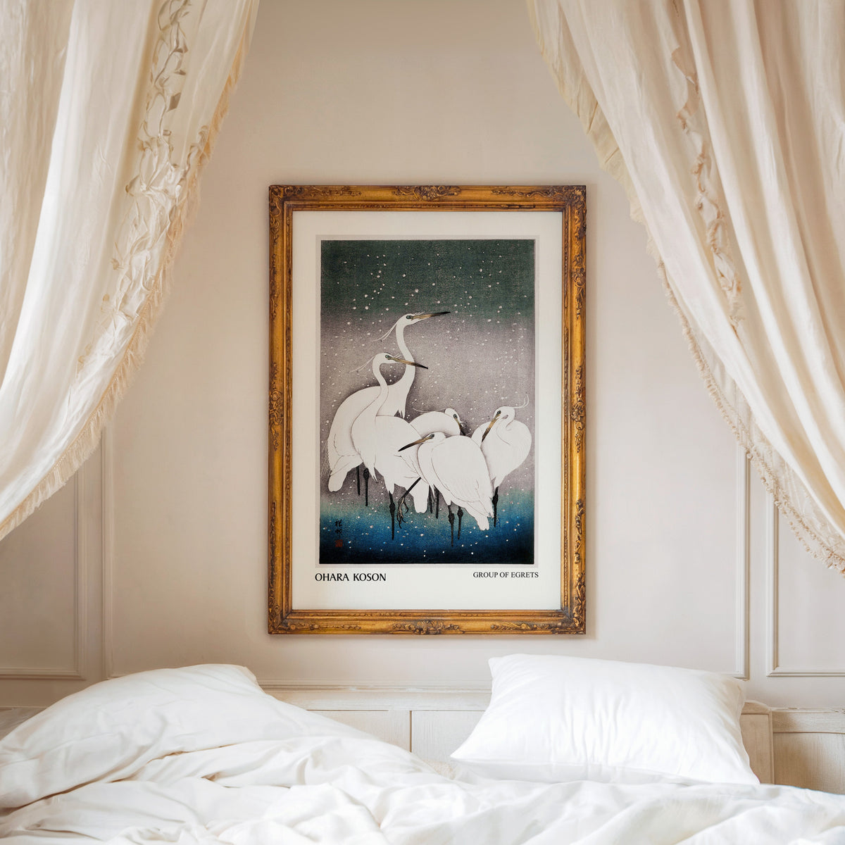 Group of Egrets print shown in an ornate gold frame above a canopy bed