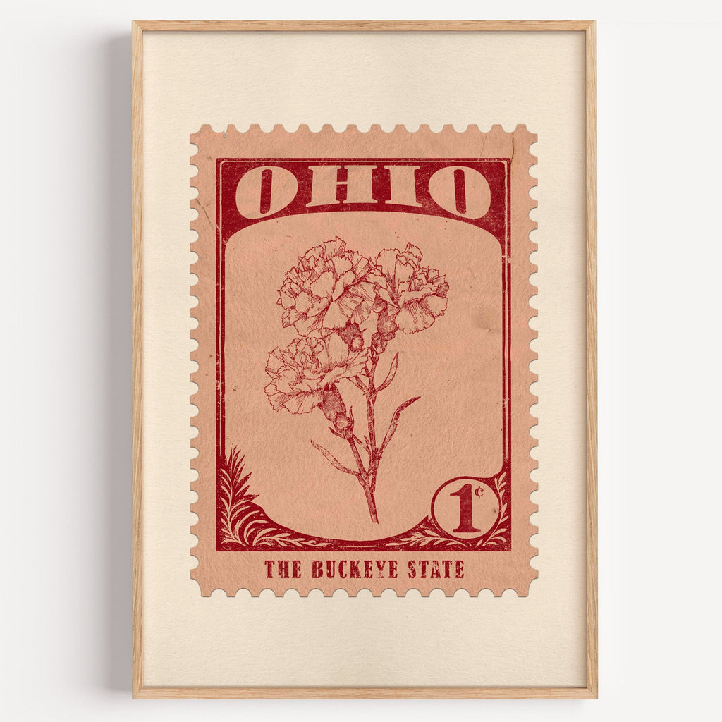 Ohio state flower stamp print in dark red on peach, light oak frame on a plain white wall