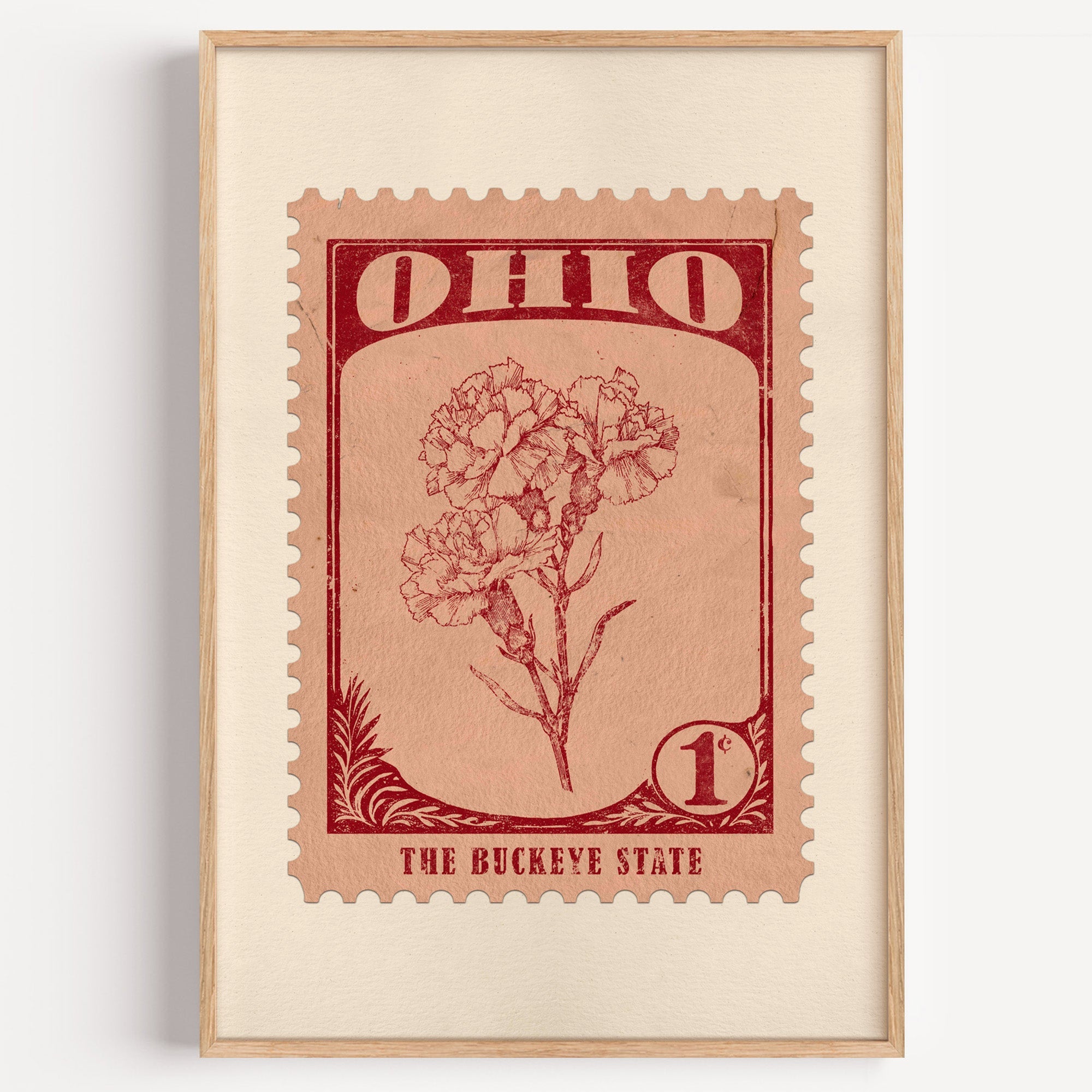 Ohio state flower stamp print in dark red on peach, light oak frame on a plain white wall