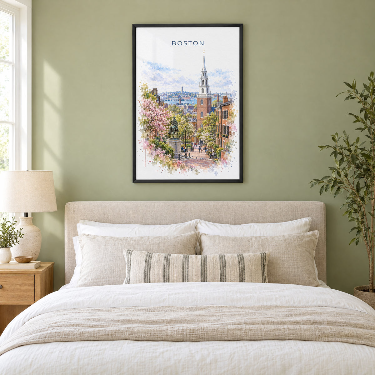 Old North Church Boston watercolor print in a black frame above an upholstered headboard in a sage green bedroom