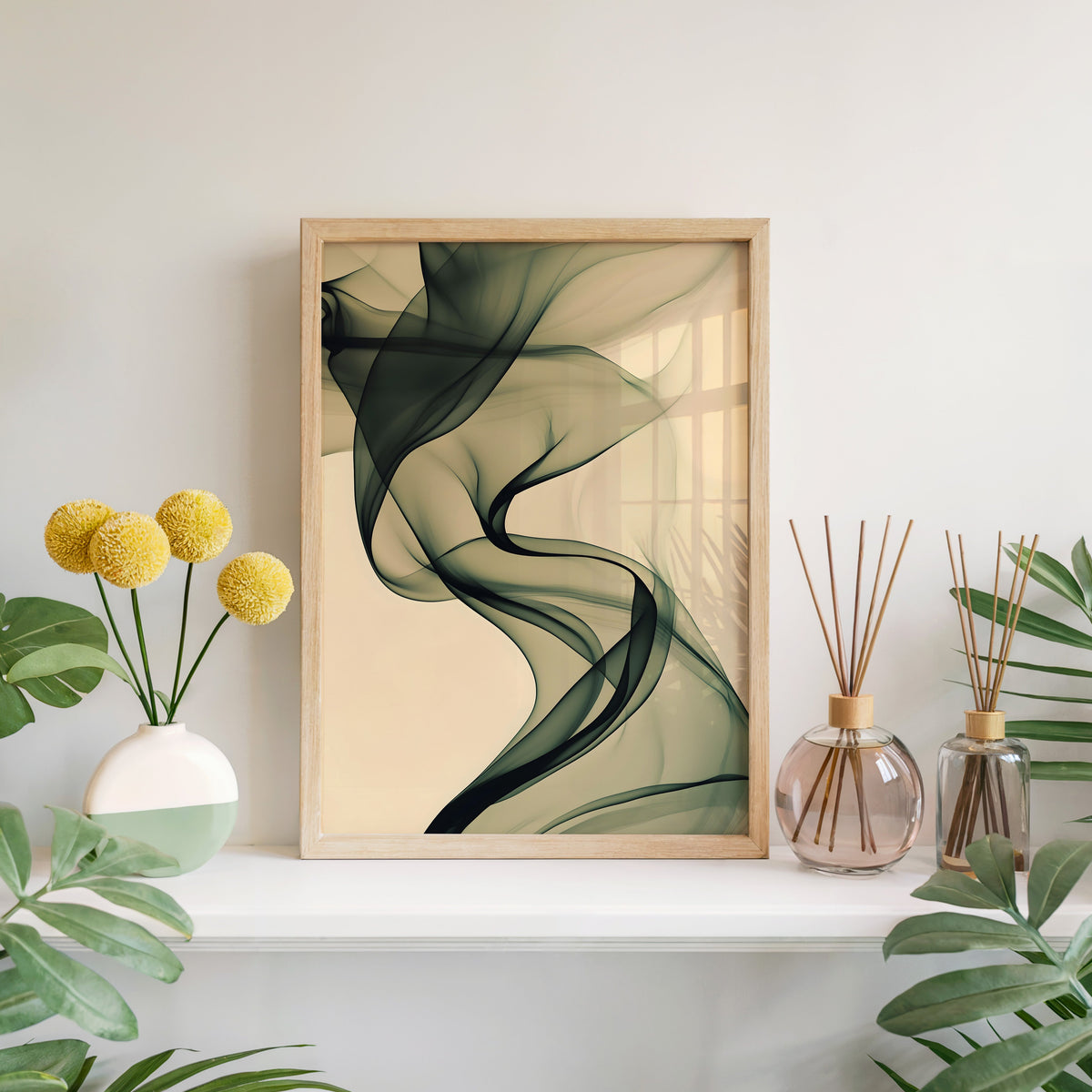 Olive smoke on cream fluid abstract print in a light oak frame leaning on a white mantel with yellow flowers