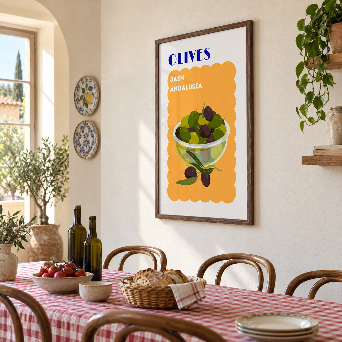 OLIVES Jaén Andalusia orange print in a walnut frame above a gingham-covered trattoria table, seen at an angle