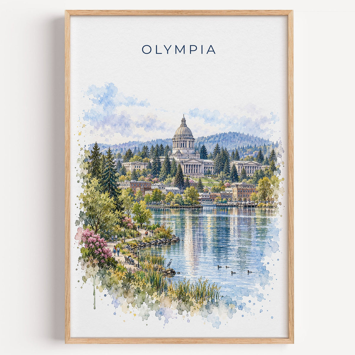 Olympia, Washington watercolor print in a light oak frame on a plain white wall