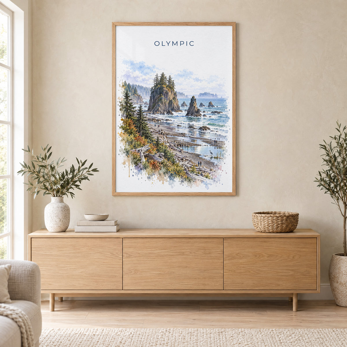 Olympic National Park watercolor print in an oak frame above a light wood sideboard in a Scandinavian living room