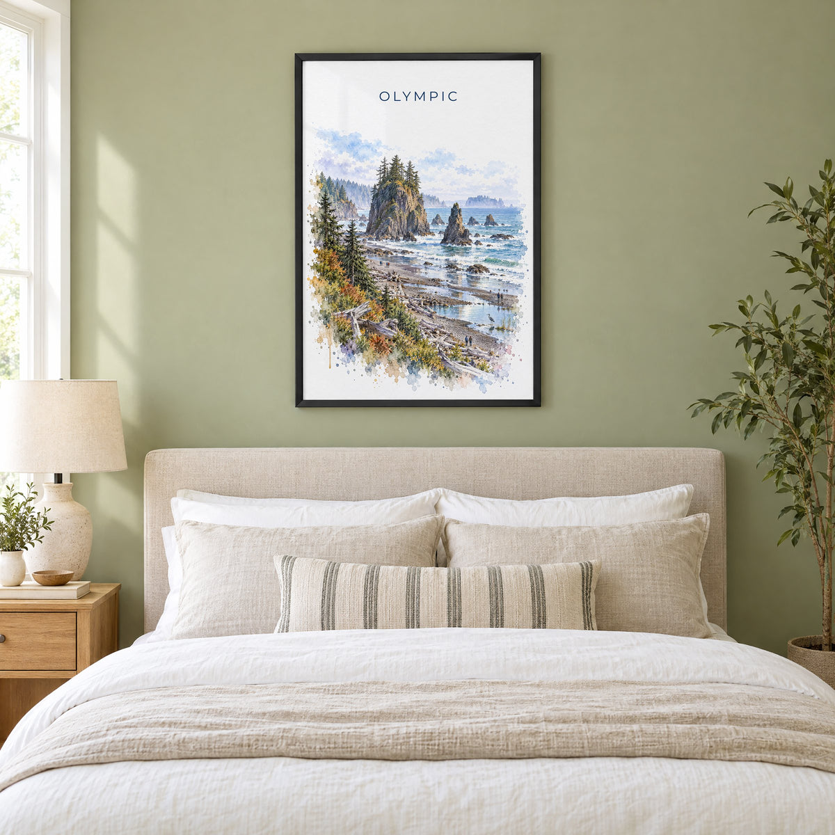 Olympic National Park watercolor print in a black frame above an upholstered headboard in a sage green bedroom