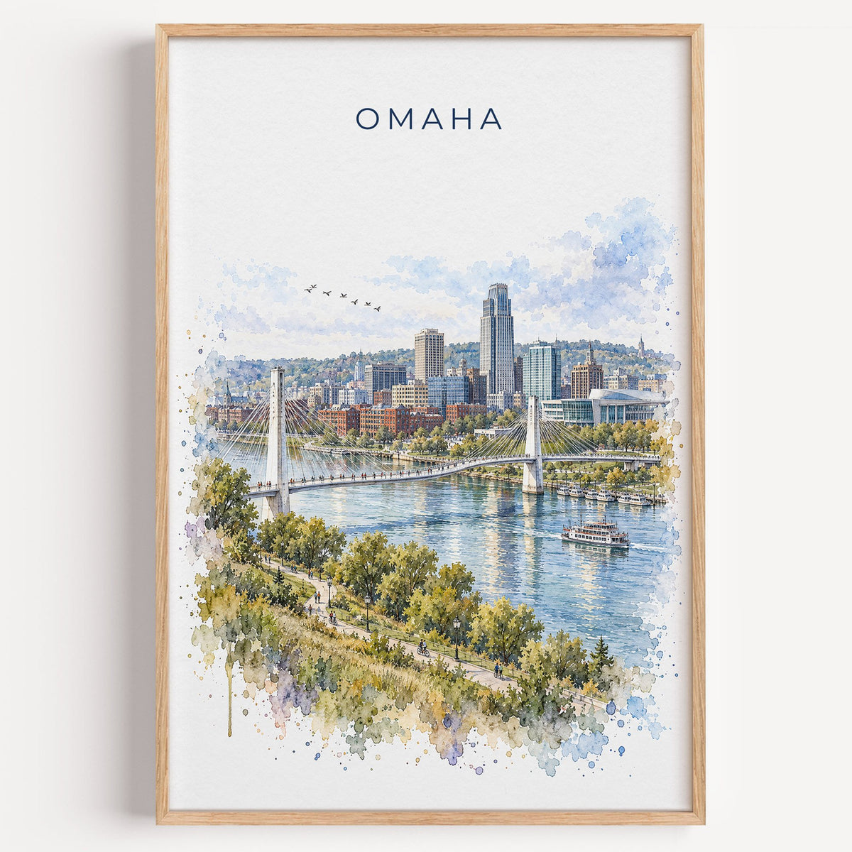 Omaha watercolor print in a light oak frame on a plain white wall