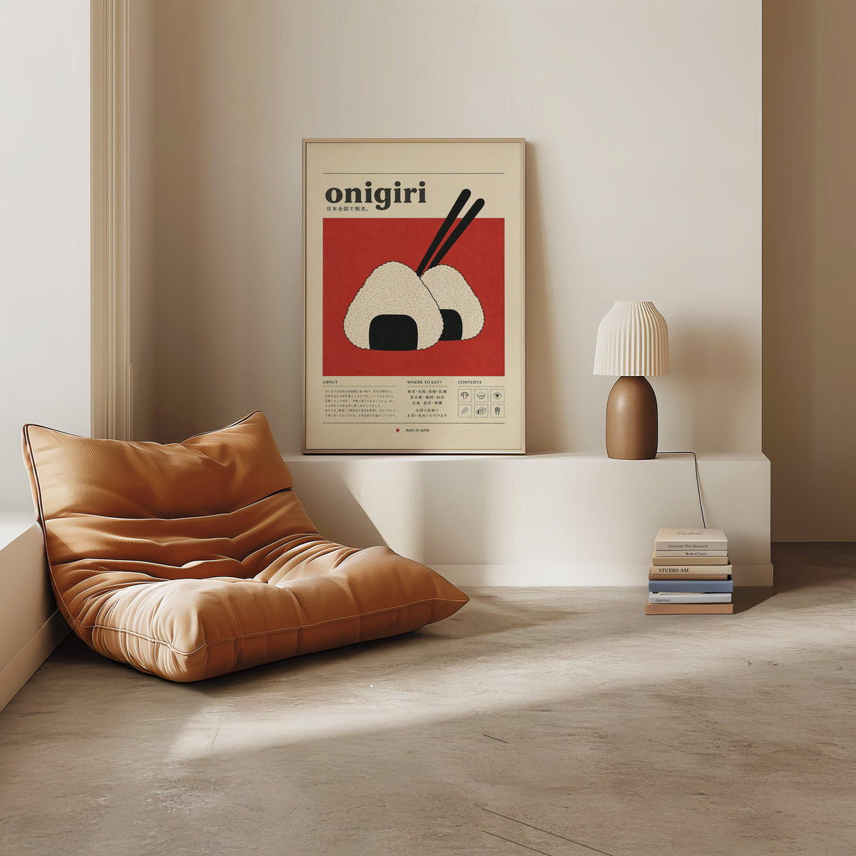 onigiri rice balls on red print in a light oak frame on a white ledge by a tan leather floor chair