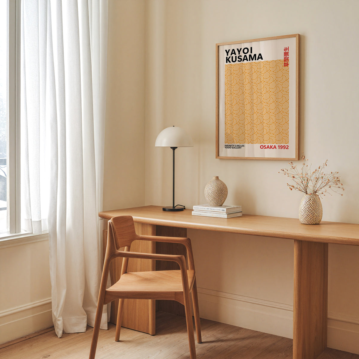 Yayoi Kusama inspired orange concentric circle print above a desk with a dome lamp