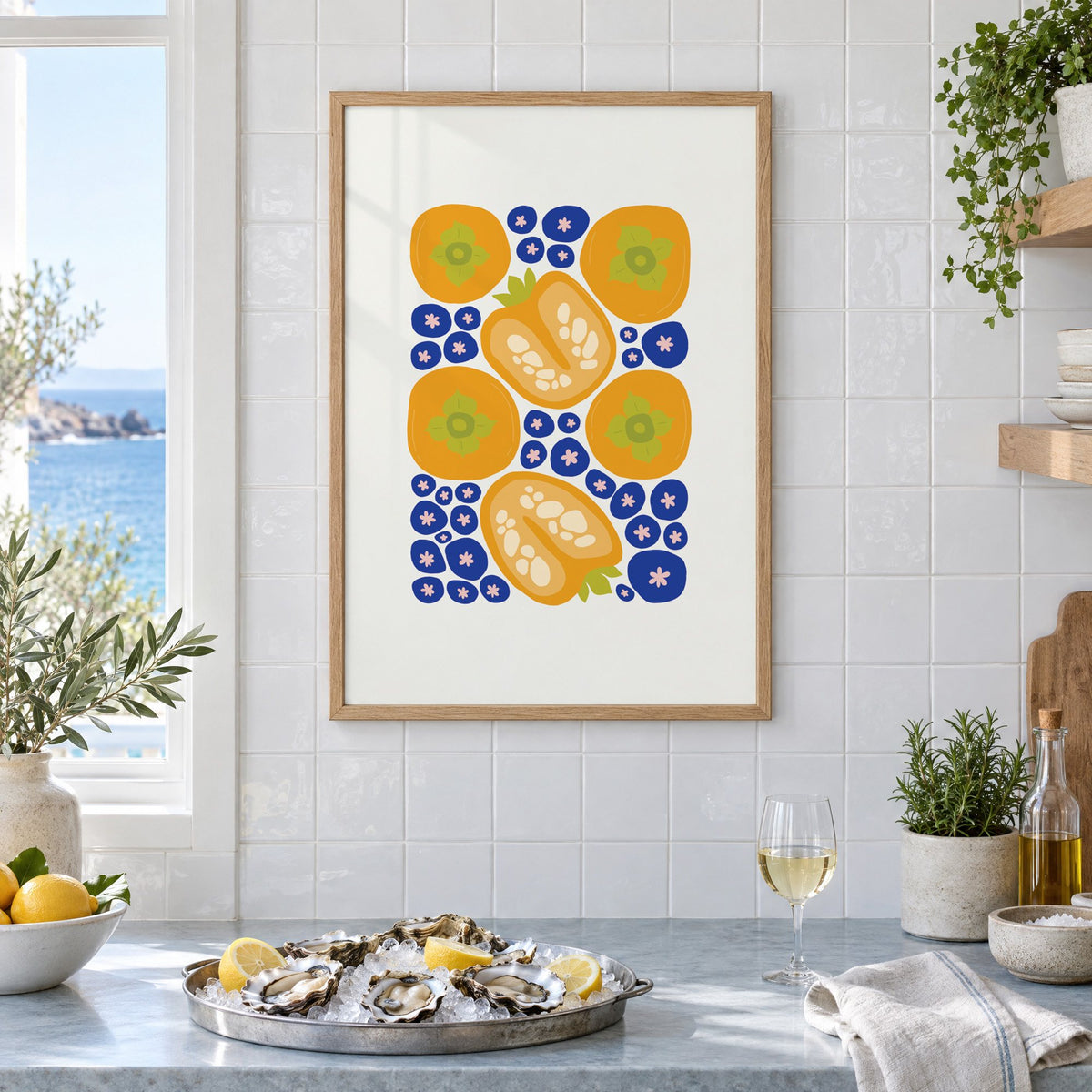 orange persimmons cobalt blueberries pattern print in an oak frame on white tiles above a marble counter with oysters and lemons by a sea view