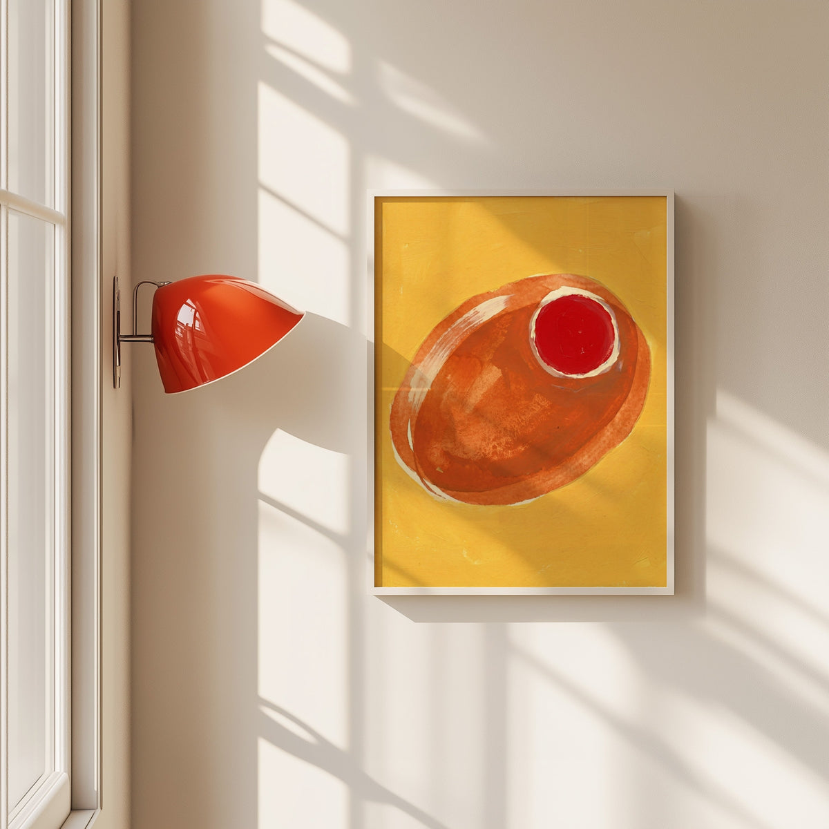 Orange stuffed olive print in a white frame beside a red wall sconce