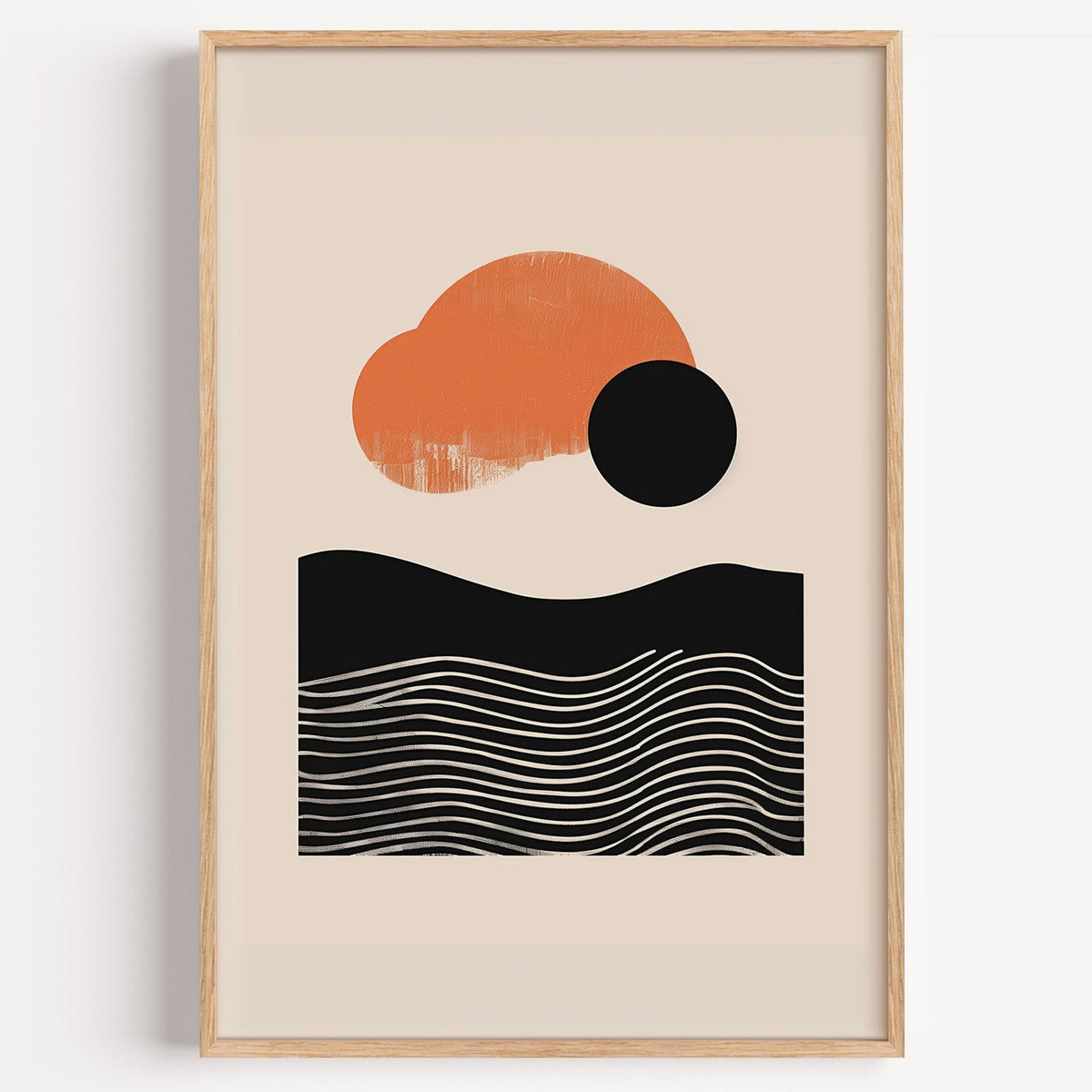 Orange sun and black wave mid century abstract print in a light oak frame on a plain white wall