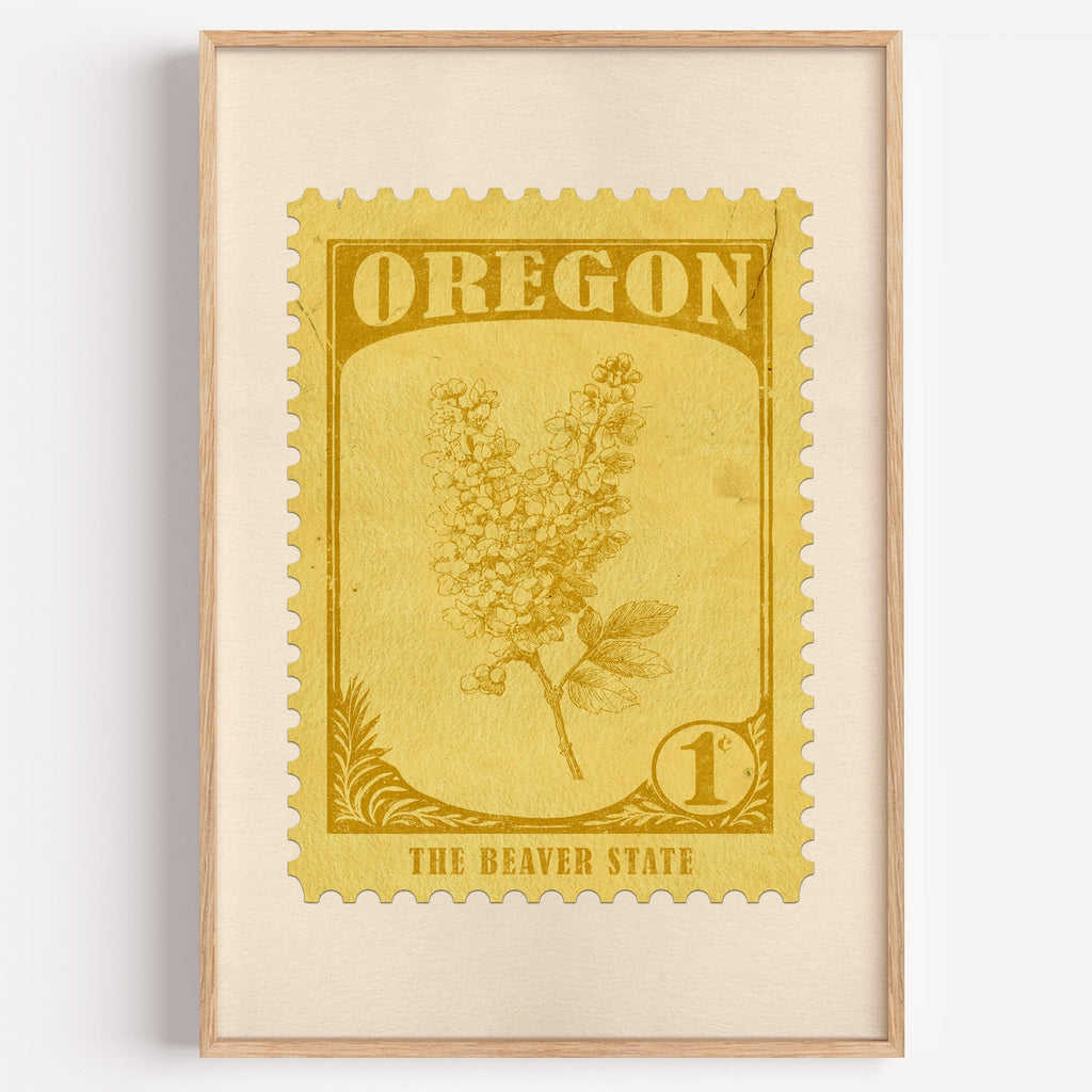 Oregon state flower stamp print in mustard gold on pale yellow, light oak frame on a plain white wall