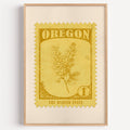 Oregon state flower stamp print in mustard gold on pale yellow, light oak frame on a plain white wall