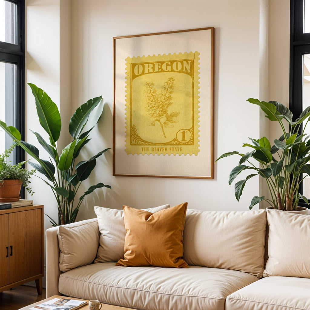 Oregon state flower print framed above a cream sofa with an ochre cushion and large plants either side