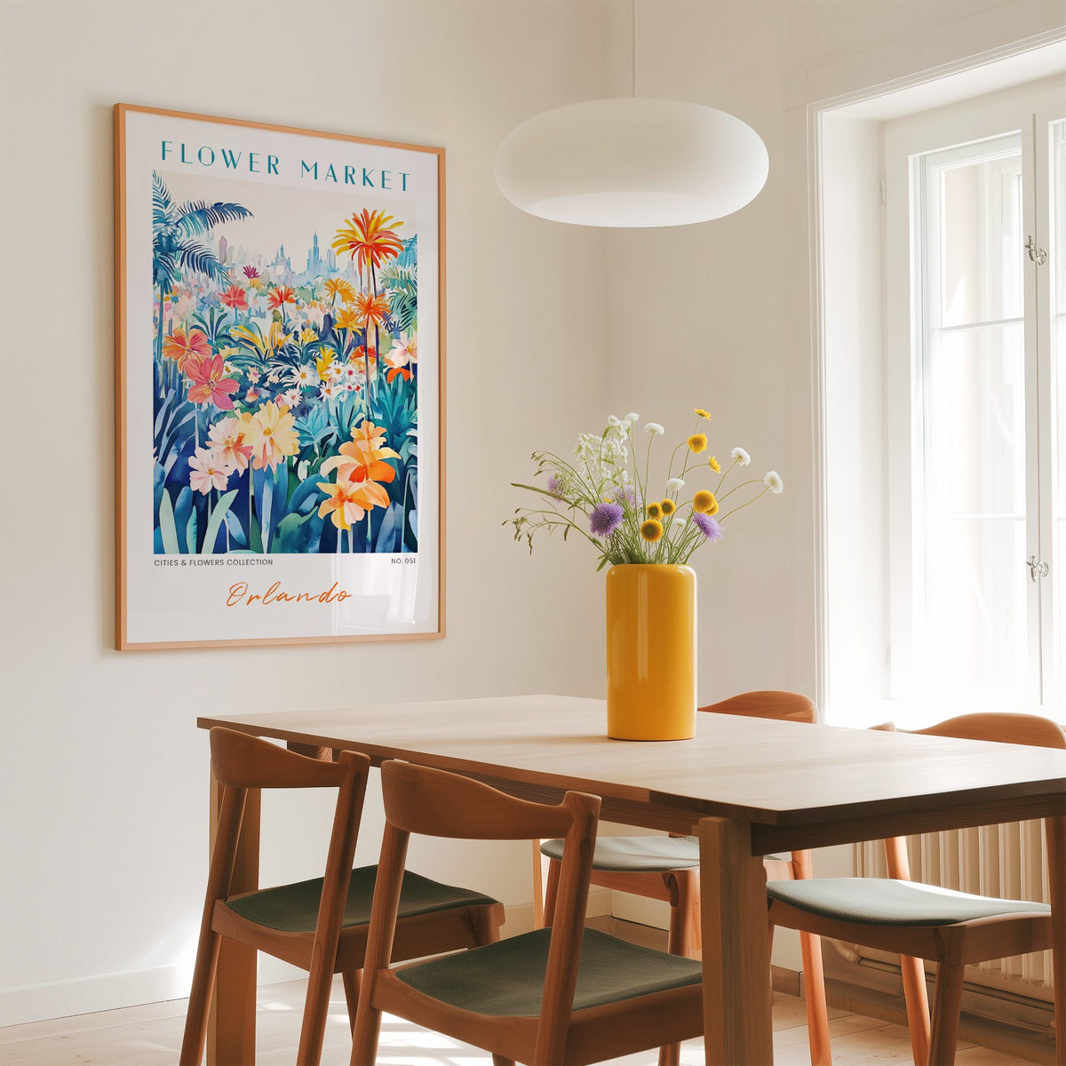 Orlando flower market print in an oak frame above a dining table with a yellow vase and white pendant light
