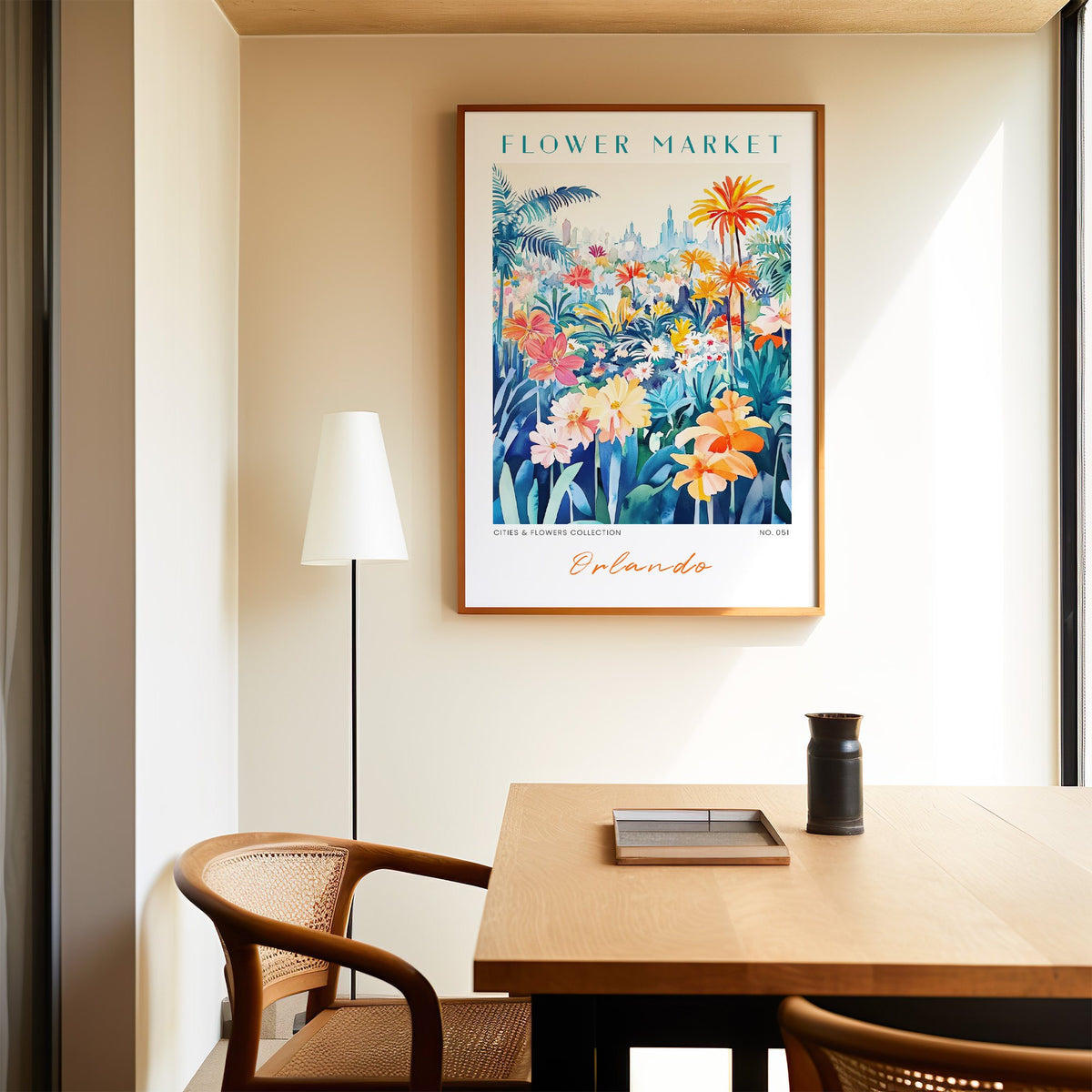 Orlando flower market print in an oak frame above a dining table and cane chair