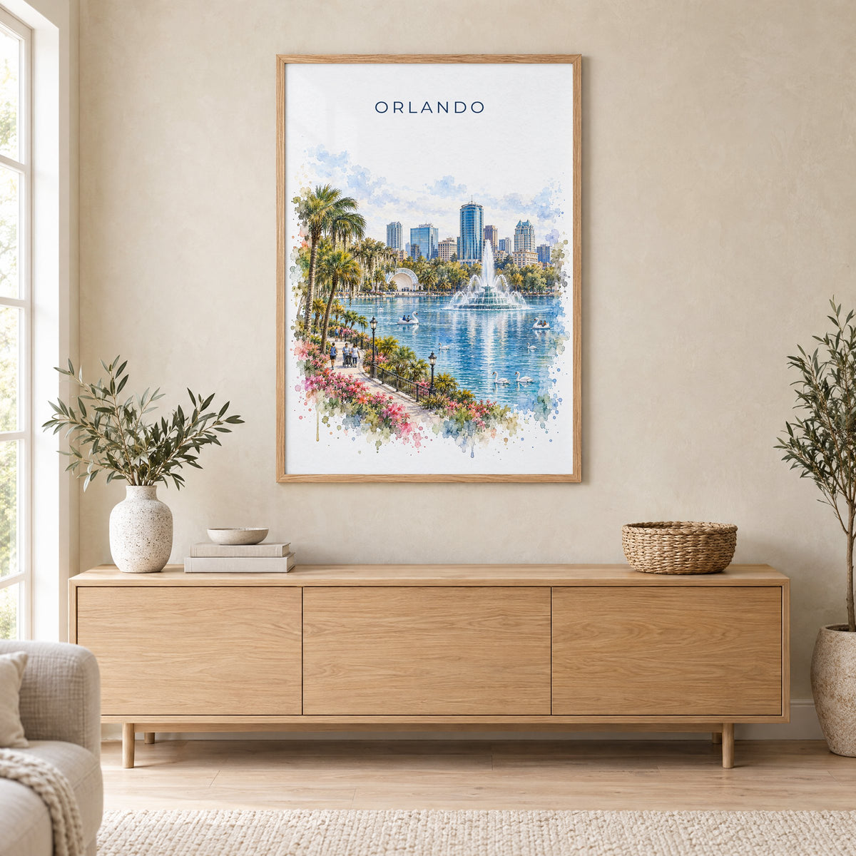 Orlando watercolor print in an oak frame above a light wood sideboard in a Scandinavian living room