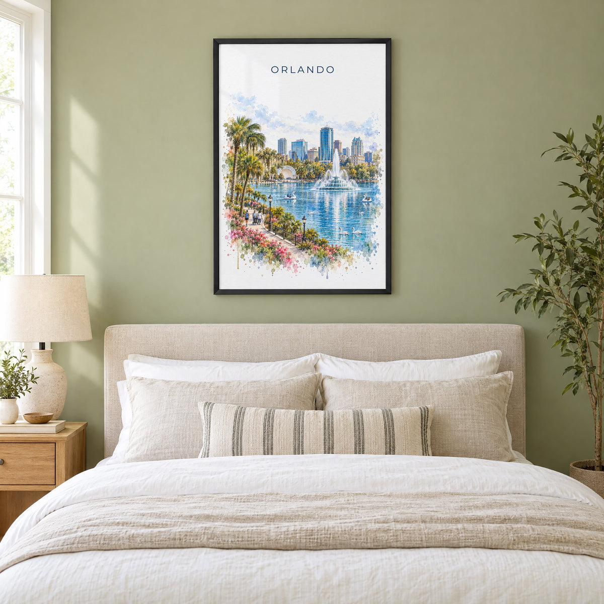 Orlando watercolor print in a black frame above an upholstered headboard in a sage green bedroom
