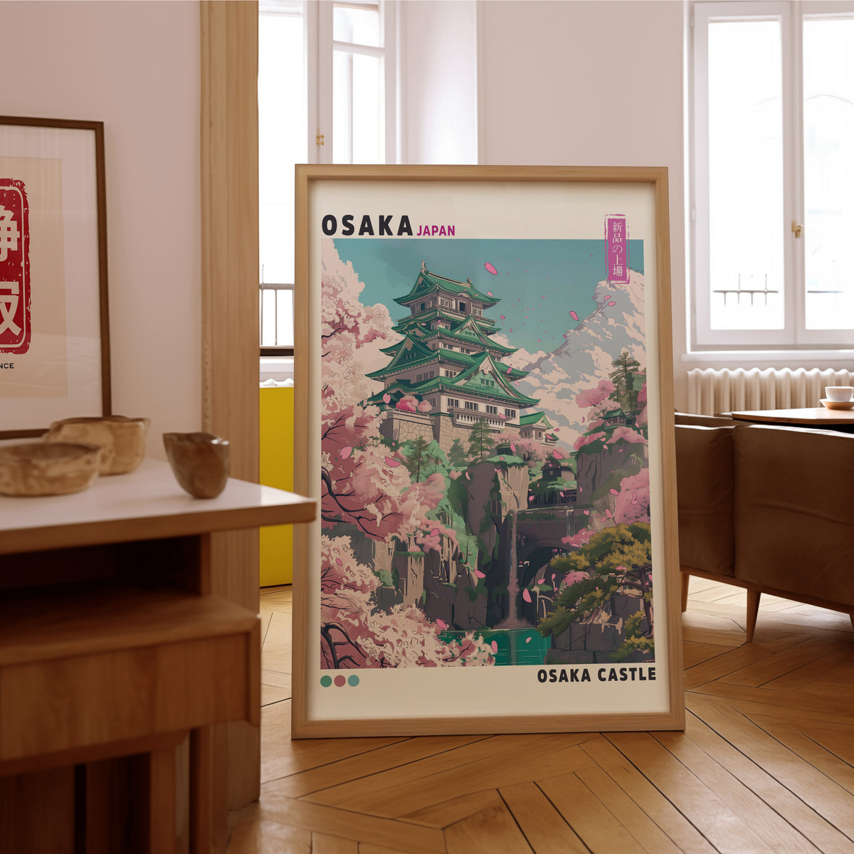 Osaka Castle with cherry blossoms print in an oak frame on the parquet floor of a sunlit living room