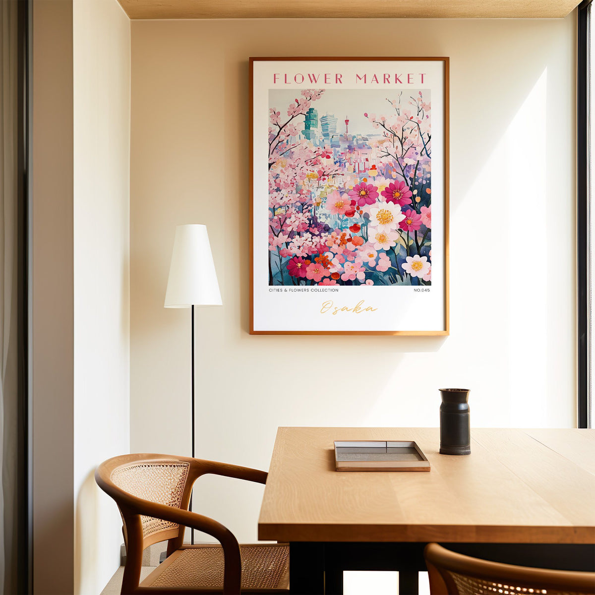 Osaka flower market print in an oak frame above a dining table and cane chair