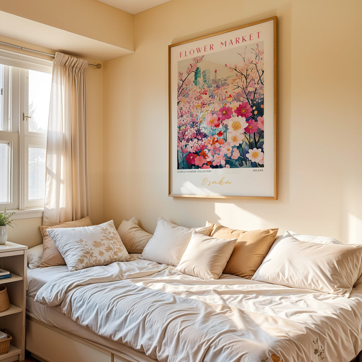 Osaka flower market print in an oak frame above a cream daybed in a sunny bedroom