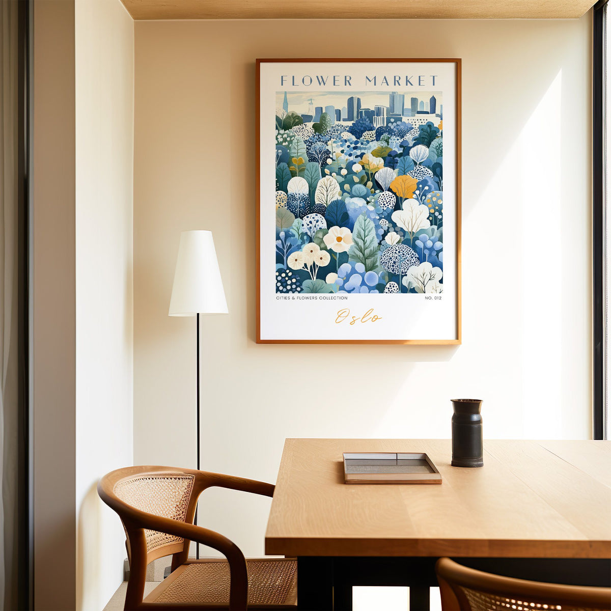 Oslo flower market print in an oak frame above a dining table and cane chair