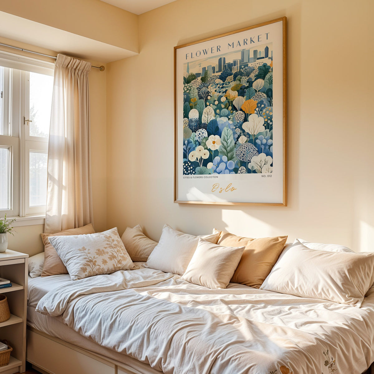Oslo flower market print in an oak frame above a cream daybed in a sunny bedroom