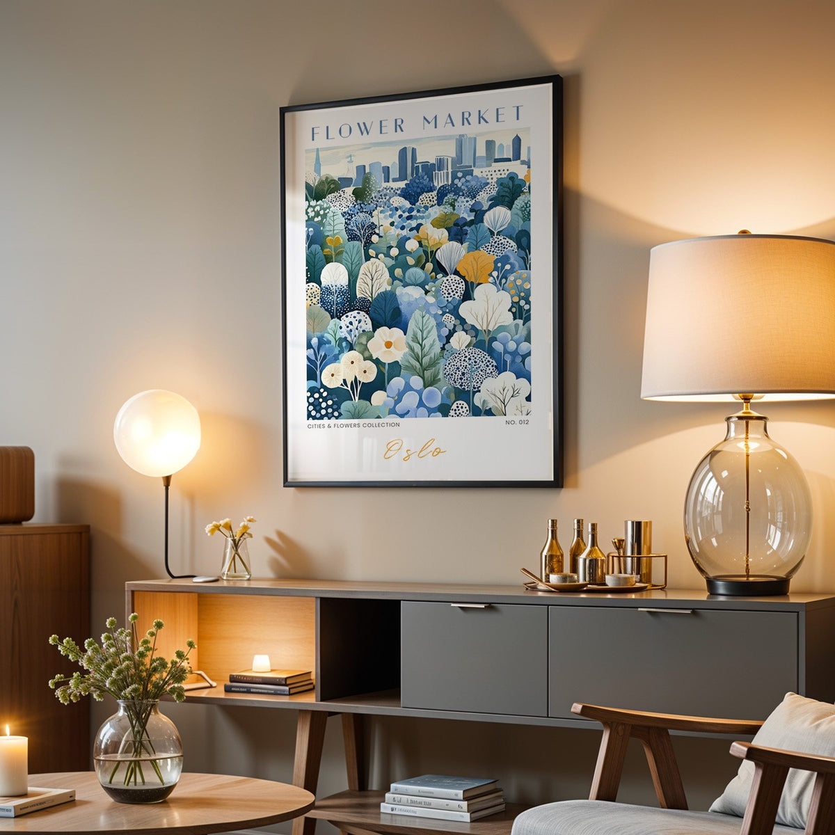 Oslo flower market print in a black frame above a grey media console with a glass table lamp