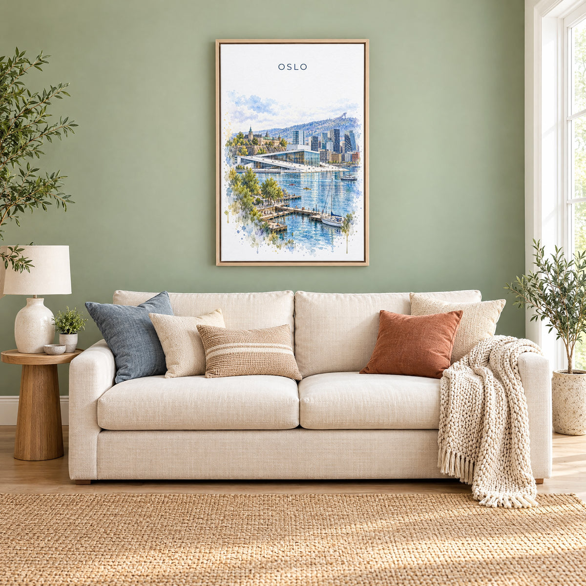 Oslo watercolor print as a natural floater canvas above a cream linen sofa on a sage green wall