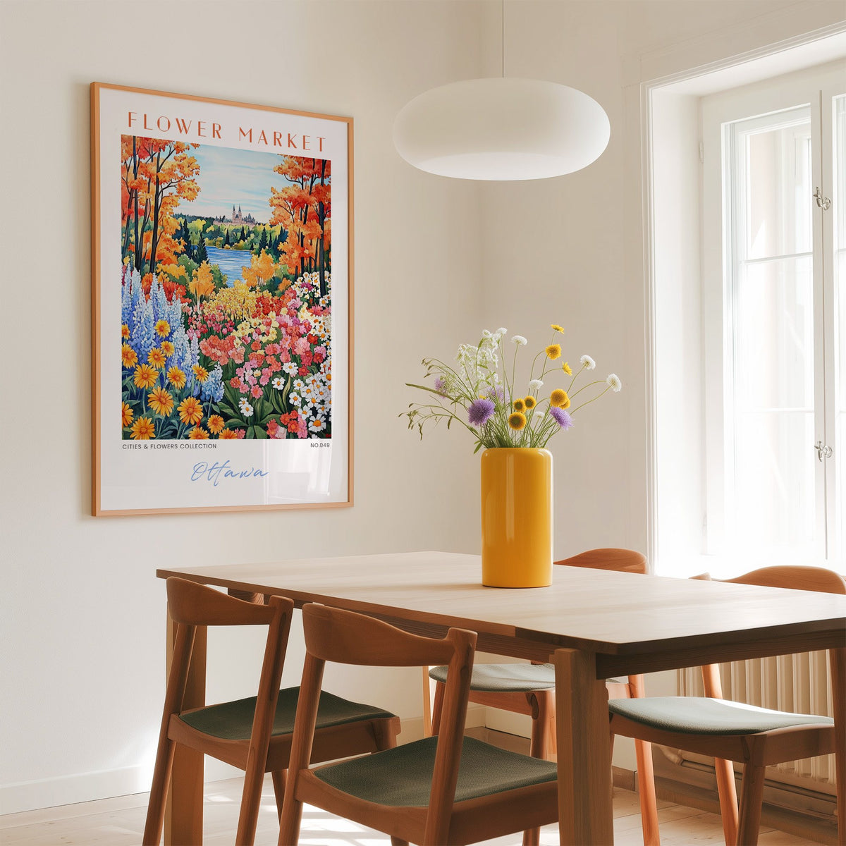 Ottawa flower market print in an oak frame above a dining table with a yellow vase and white pendant light