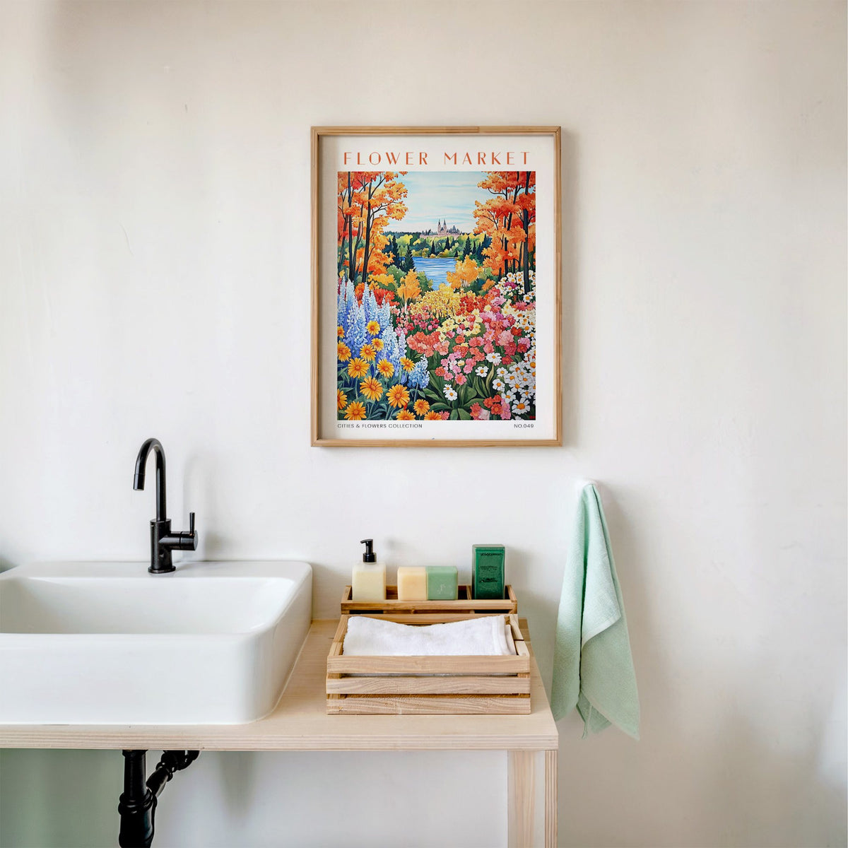 Ottawa flower market print in an oak frame above a white bathroom sink with folded towels
